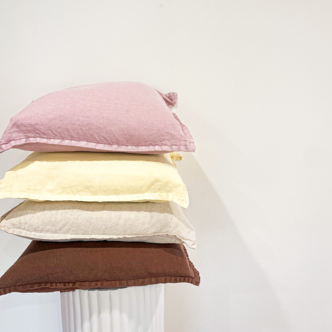 100% belgium linen vintage washed cushion- feather filled in linen, styled shot
