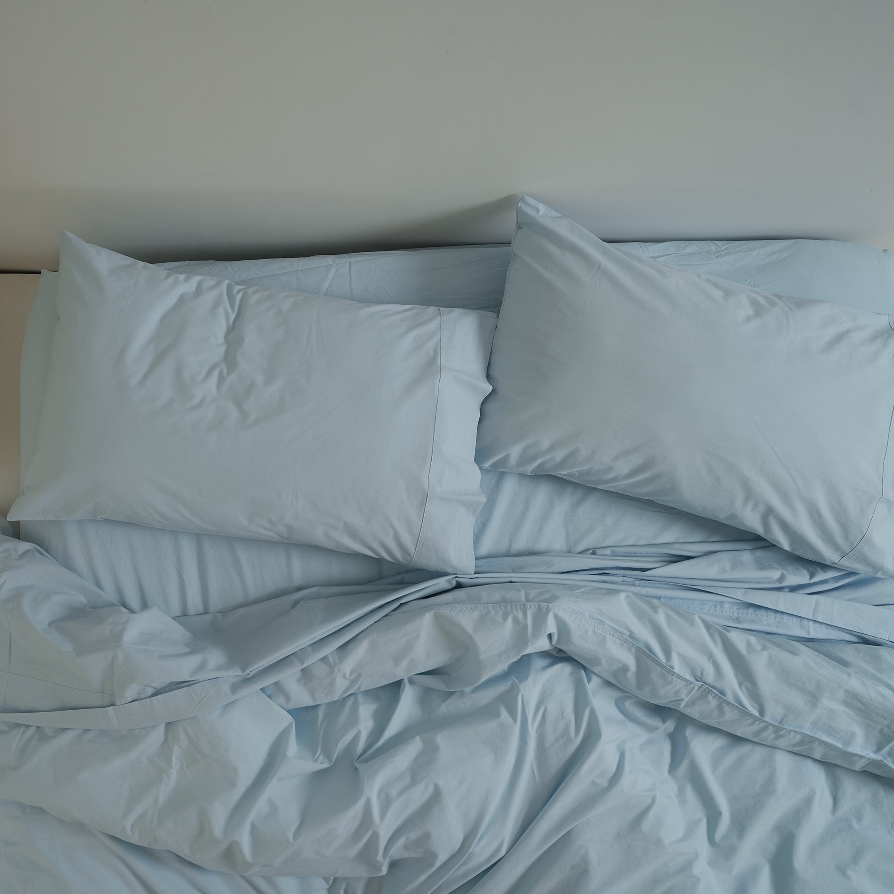 100% stonewashed cotton duvet set in sky blue, close-up