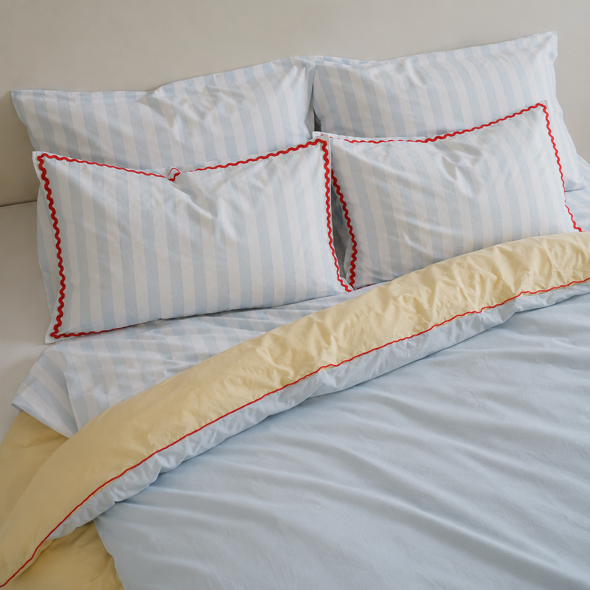 Bonnie pillowcase pair in Sky Blue Stripe/red Trim side view
