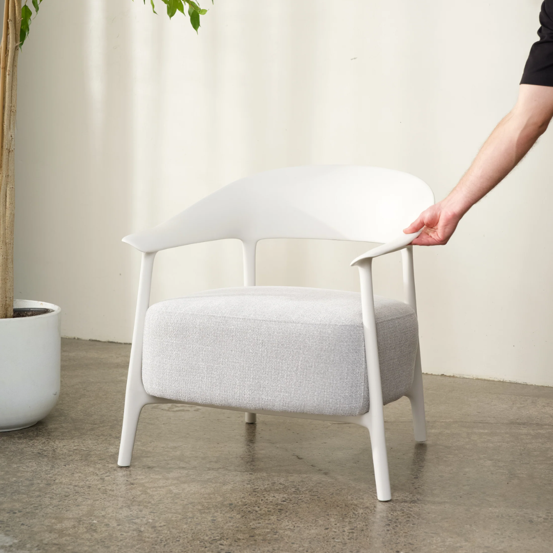 Alan chair, curved frame, tapered legs, textured fabric seat, detail view