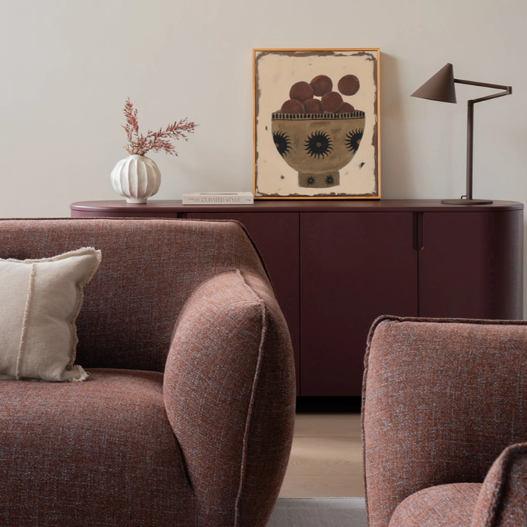 Nearly Famous armchair, rounded silhouette, plush upholstery, alternate angle