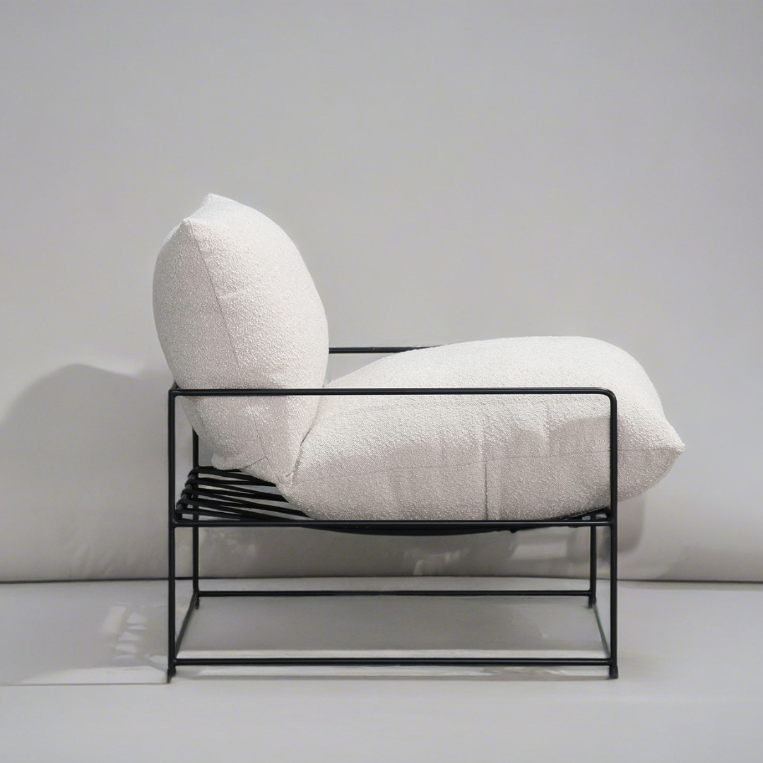 Sammie boucle sling chair in beige, styled shot
