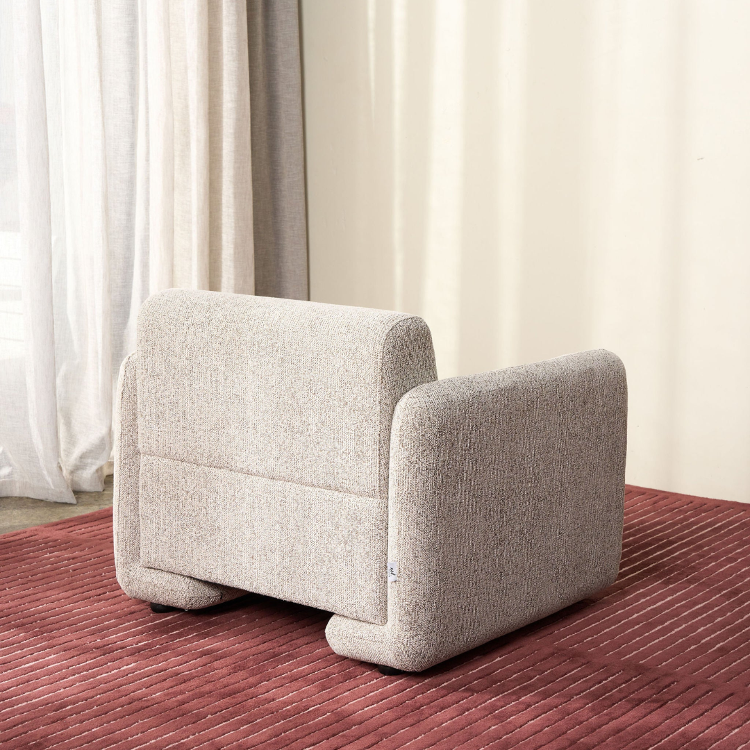 Tanner chair in Espresso, low-slung seat, textured fabric, side view