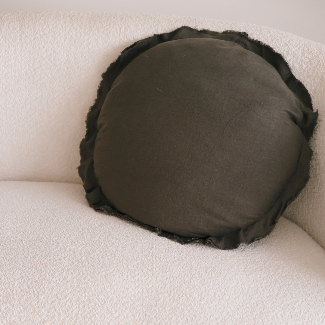 100% flax linen round feather filled cushion in deep moss, detail view