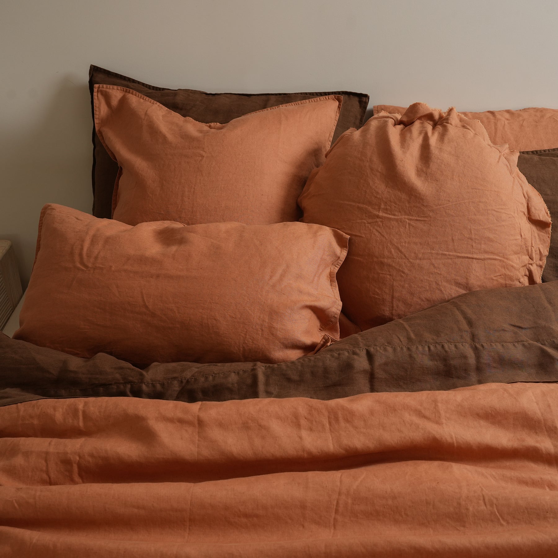 100% flax linen round feather filled cushion in hazelnut, detail view