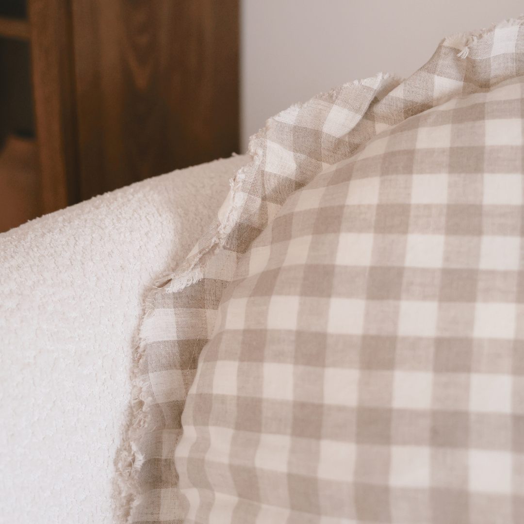 100% flax linen round feather filled cushion in natural gingham, detail view