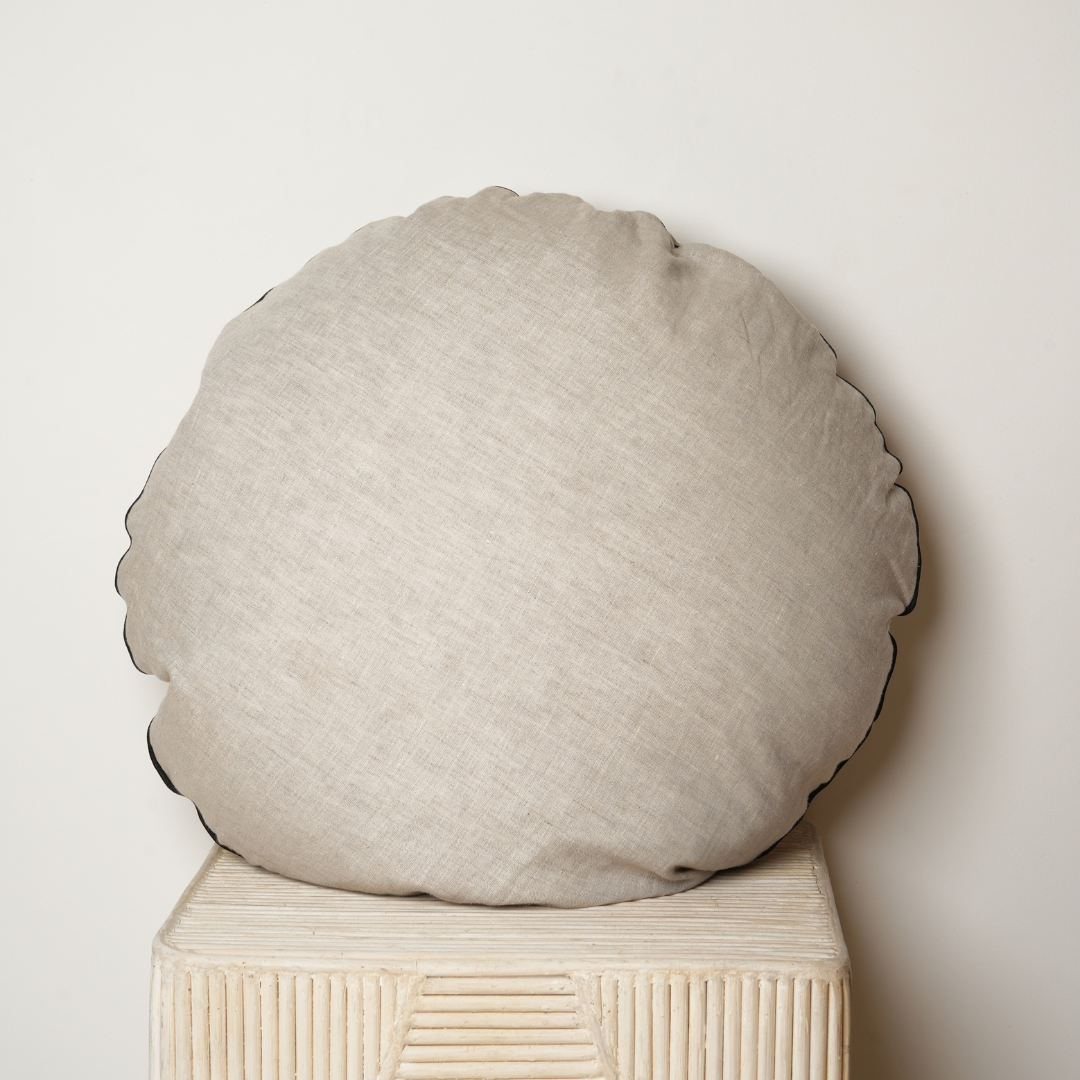 100% flax linen round piped feather filled cushion in natural oat/ black