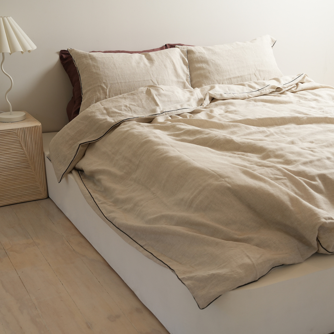 100% french flax linen piped duvet cover set in natural oat /black, styled shot