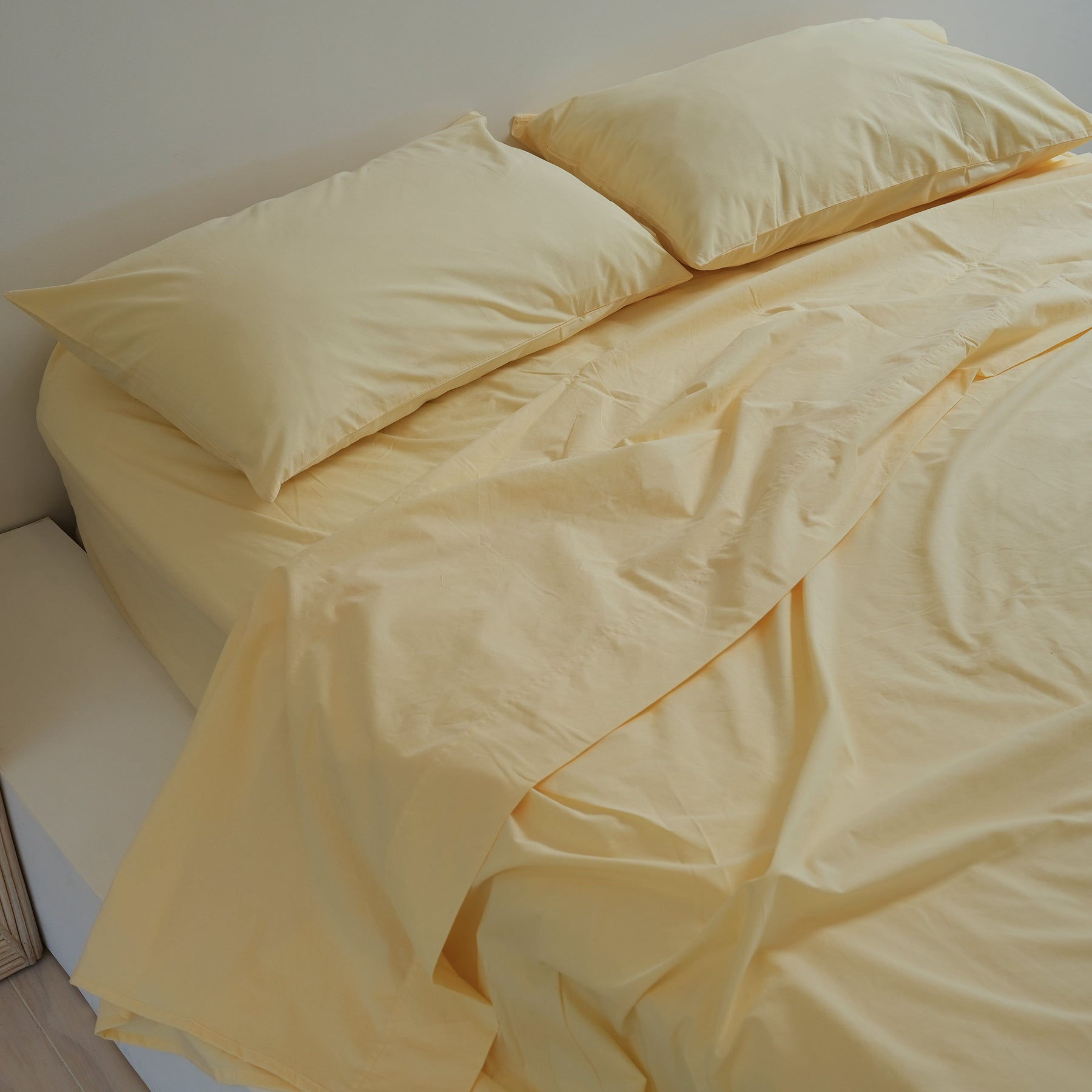 100% stonewashed cotton pillowcase pair in butter, close-up