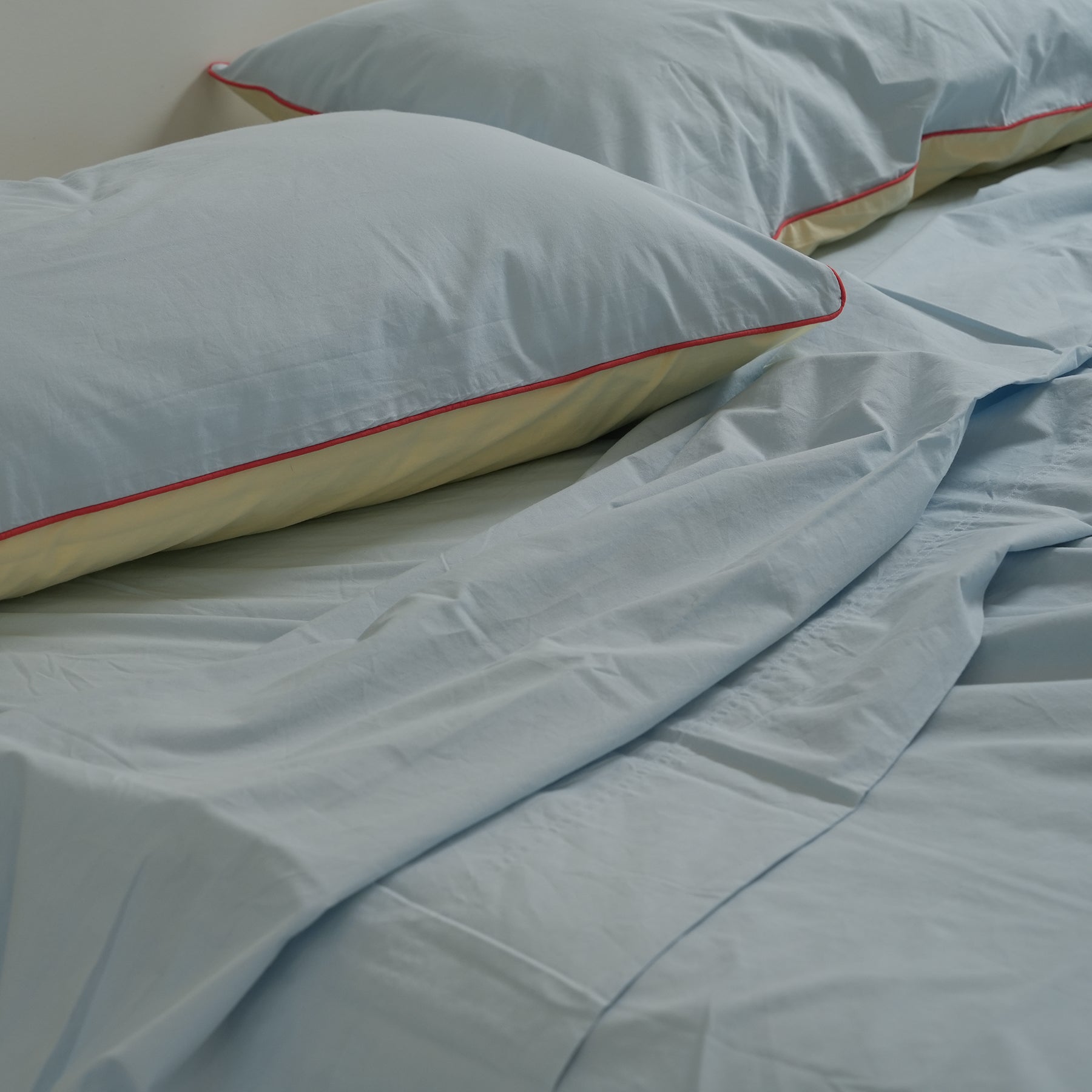 100% stonewashed cotton pillowcase pair in butter/sky reversible, close-up