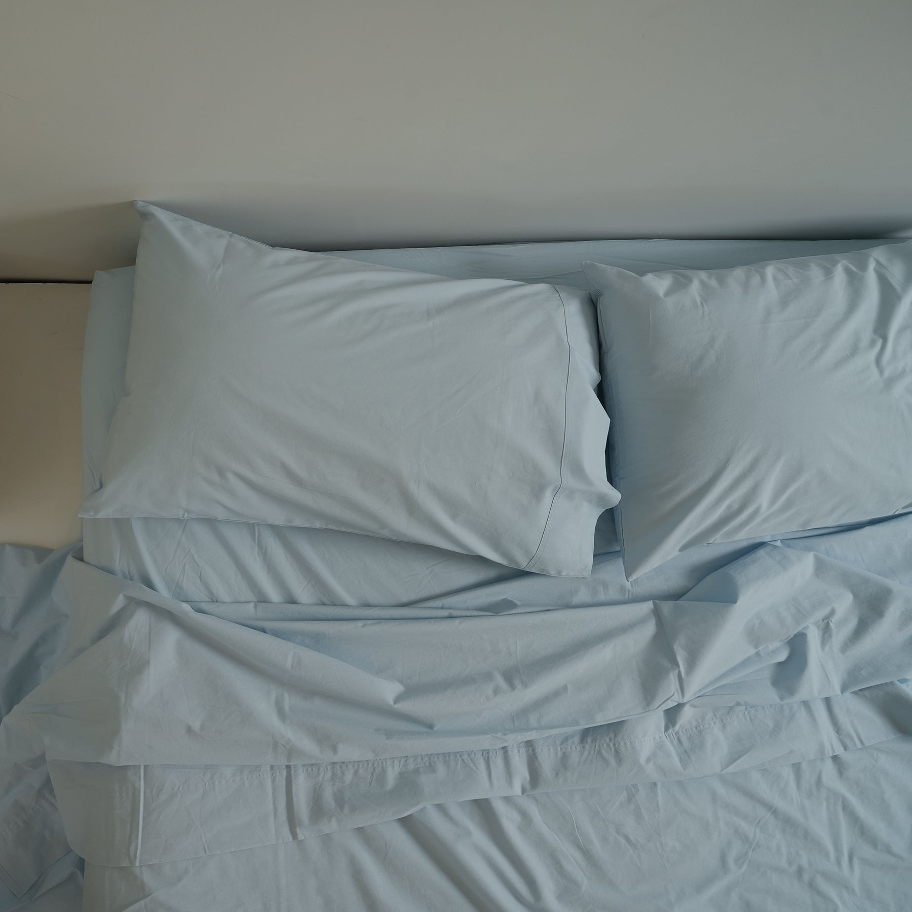 100% stonewashed cotton pillowcase pair in sky blue, close-up