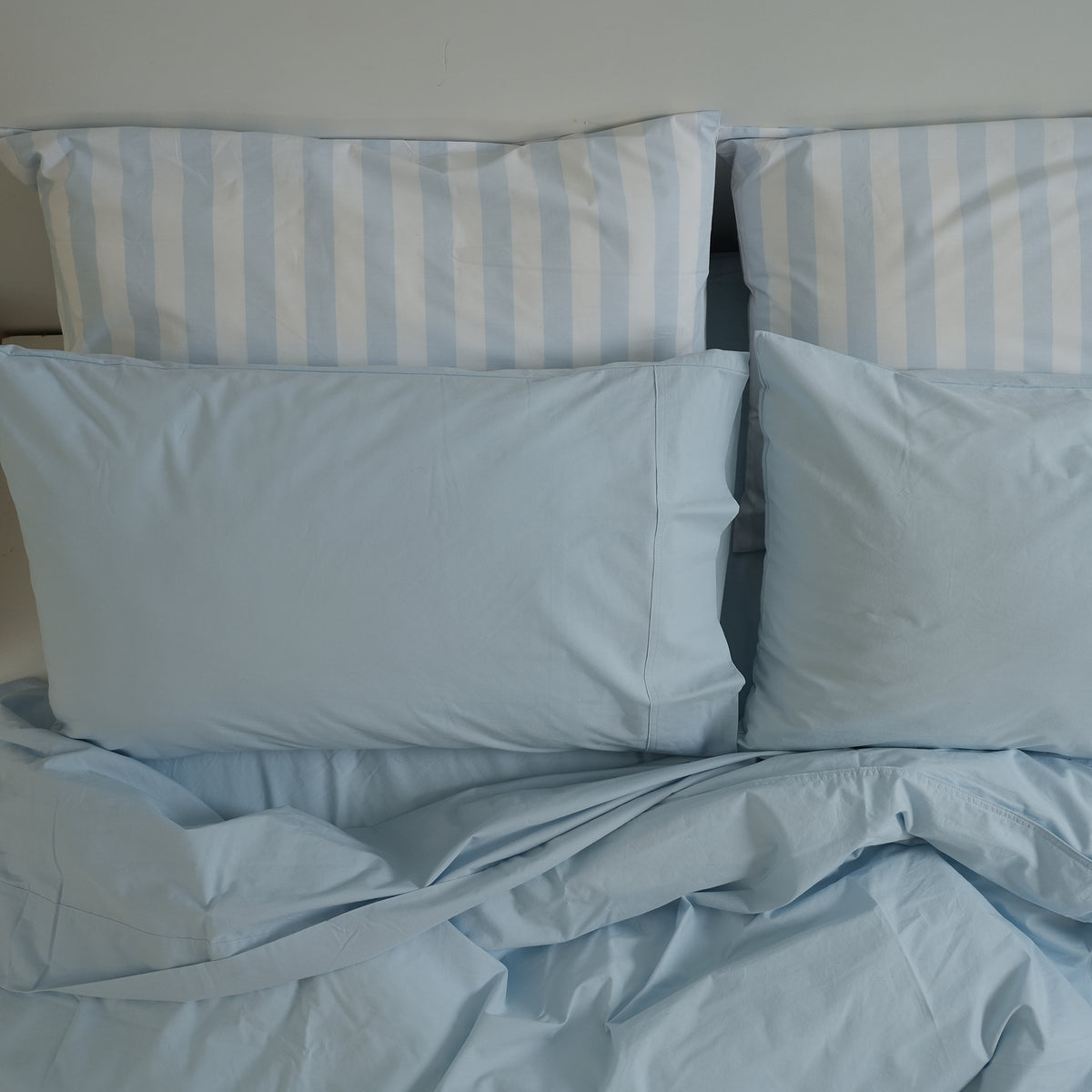 100% stonewashed cotton sheet set in sky blue, styled shot