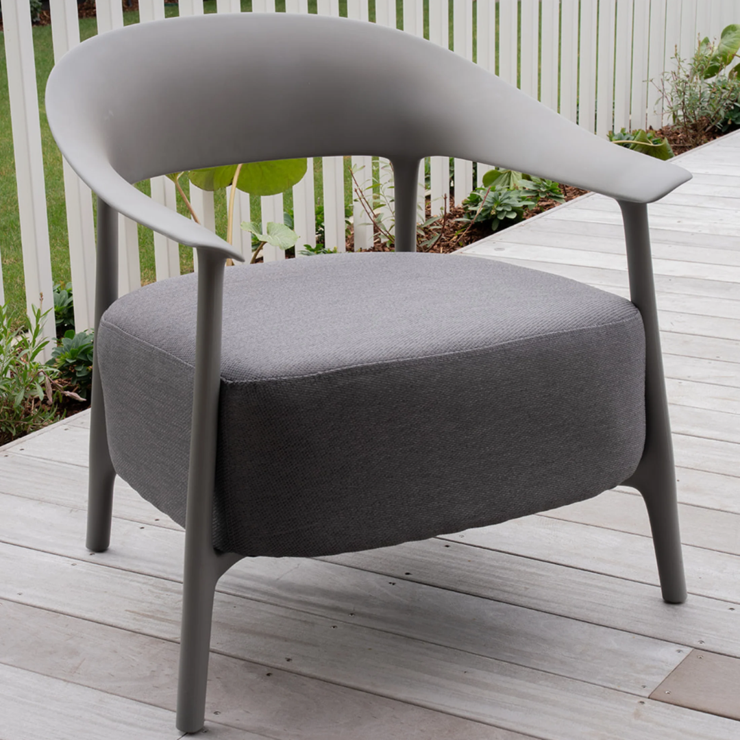 Alan chair, curved frame, tapered legs, textured fabric seat, side view