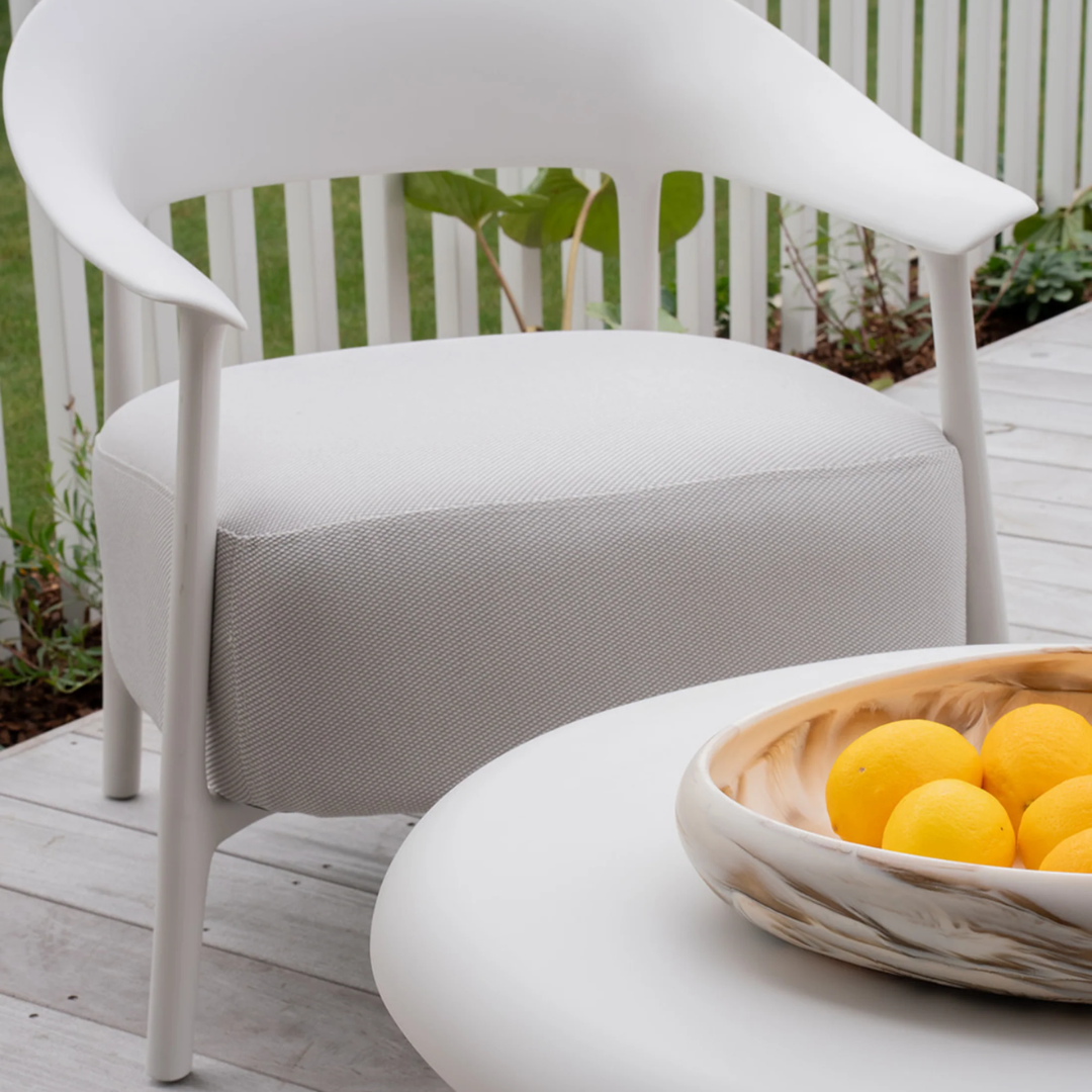 Alan chair, curved frame, tapered legs, textured fabric seat, styled view