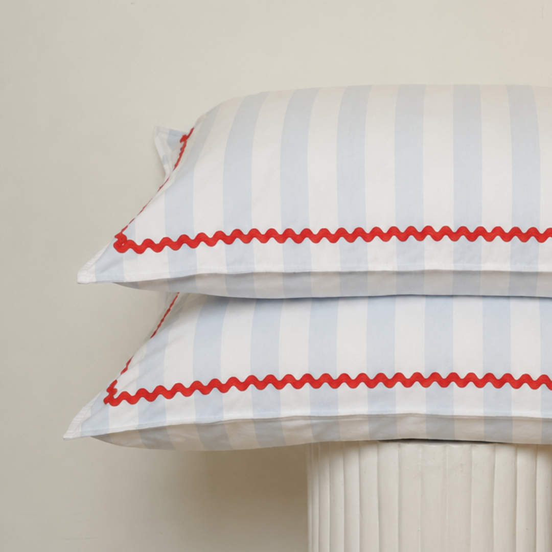 Bonnie pillowcase pair in sky blue stripe/red trim