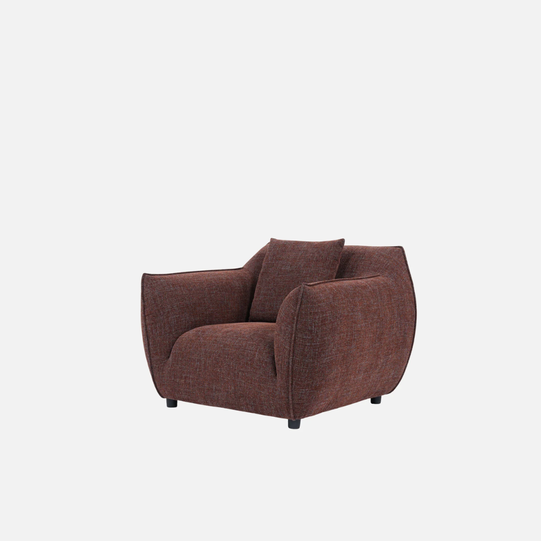Nearly Famous armchair, rounded silhouette, plush upholstery, side view