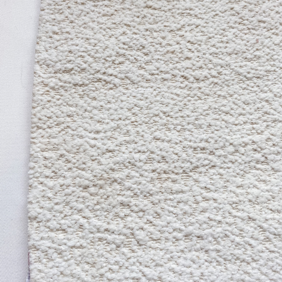 Slim frame boucle chair detail view