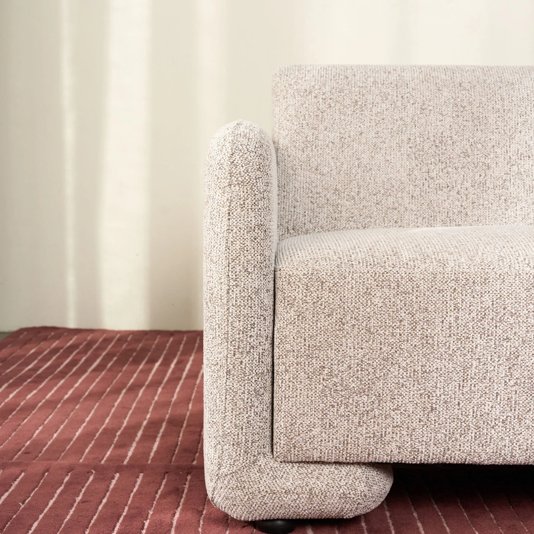 Tanner chair in Espresso, low-slung seat, textured fabric, detail view
