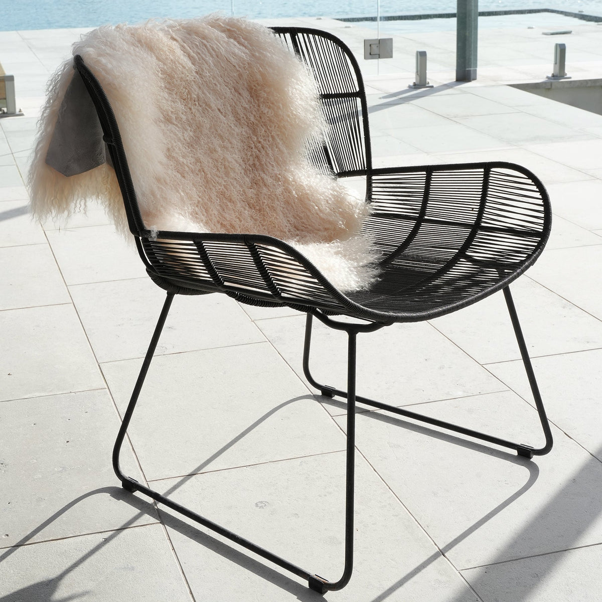 Tibetan lambskin rug in Cream side view